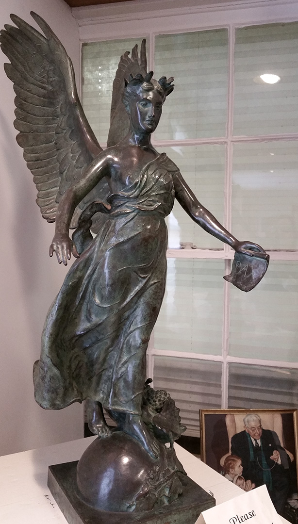 Winged Woman bronze sculpture at the Clinton County History Center