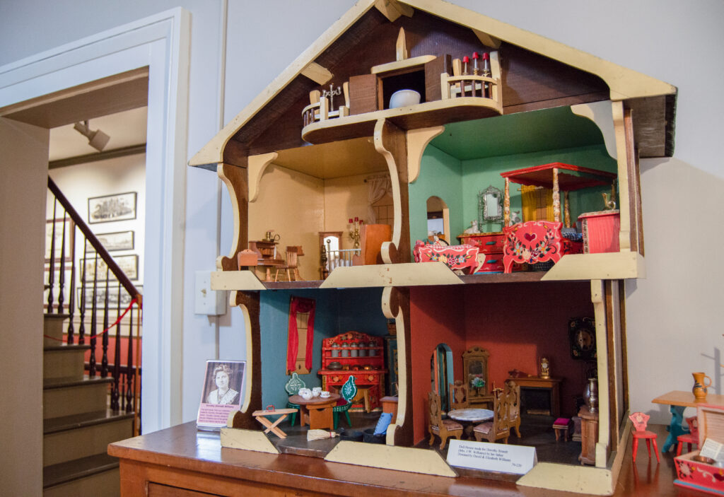 Antique toy pig and toy dog on display at the Clinton County History Center