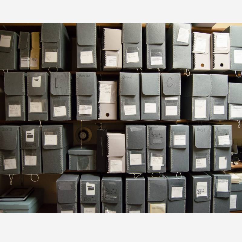 Shelves filled with labeled archival boxes
