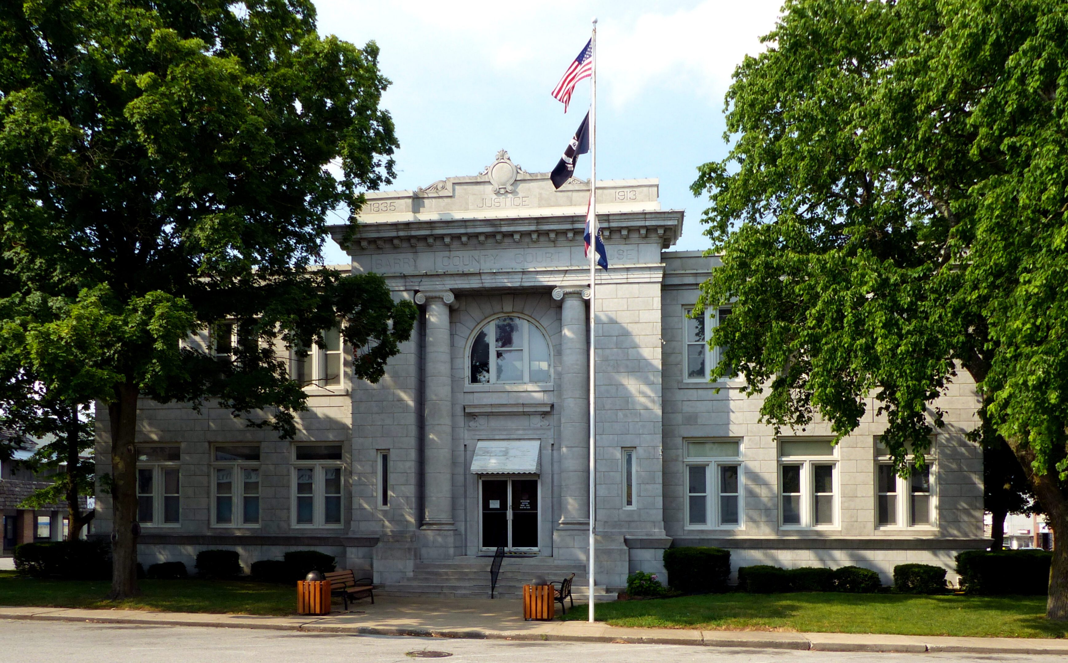 Courthouse facade surrounded by greenery