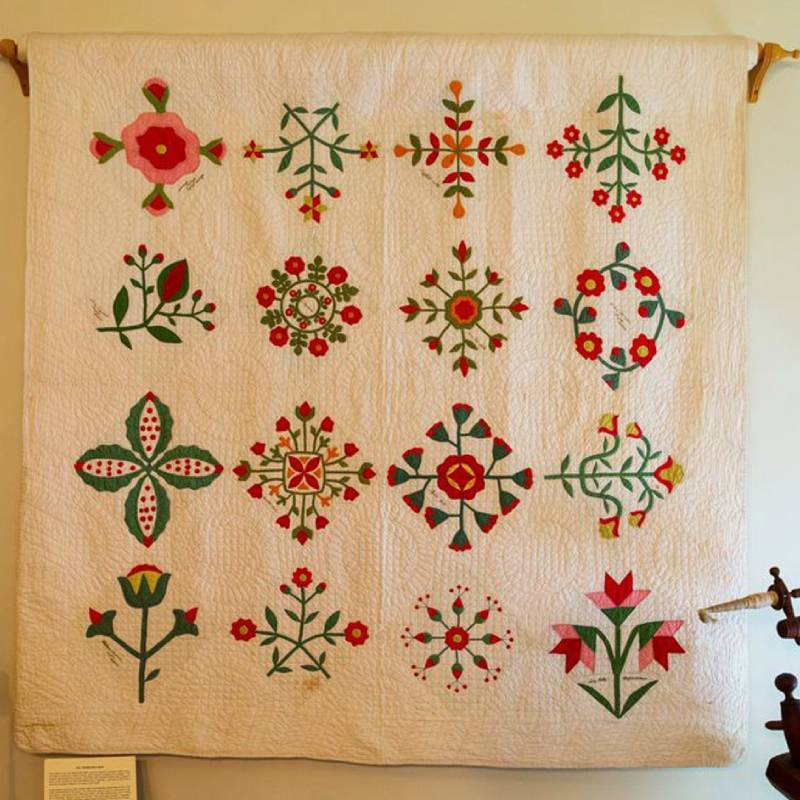 Intricate floral quilt wall hanging
