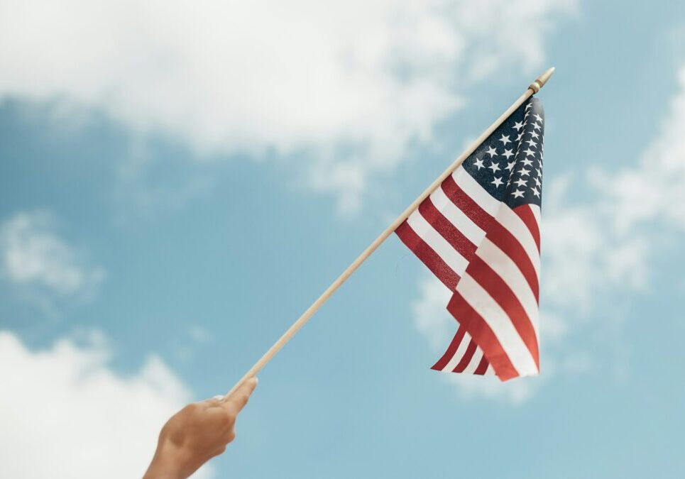 USA flag waving in hand